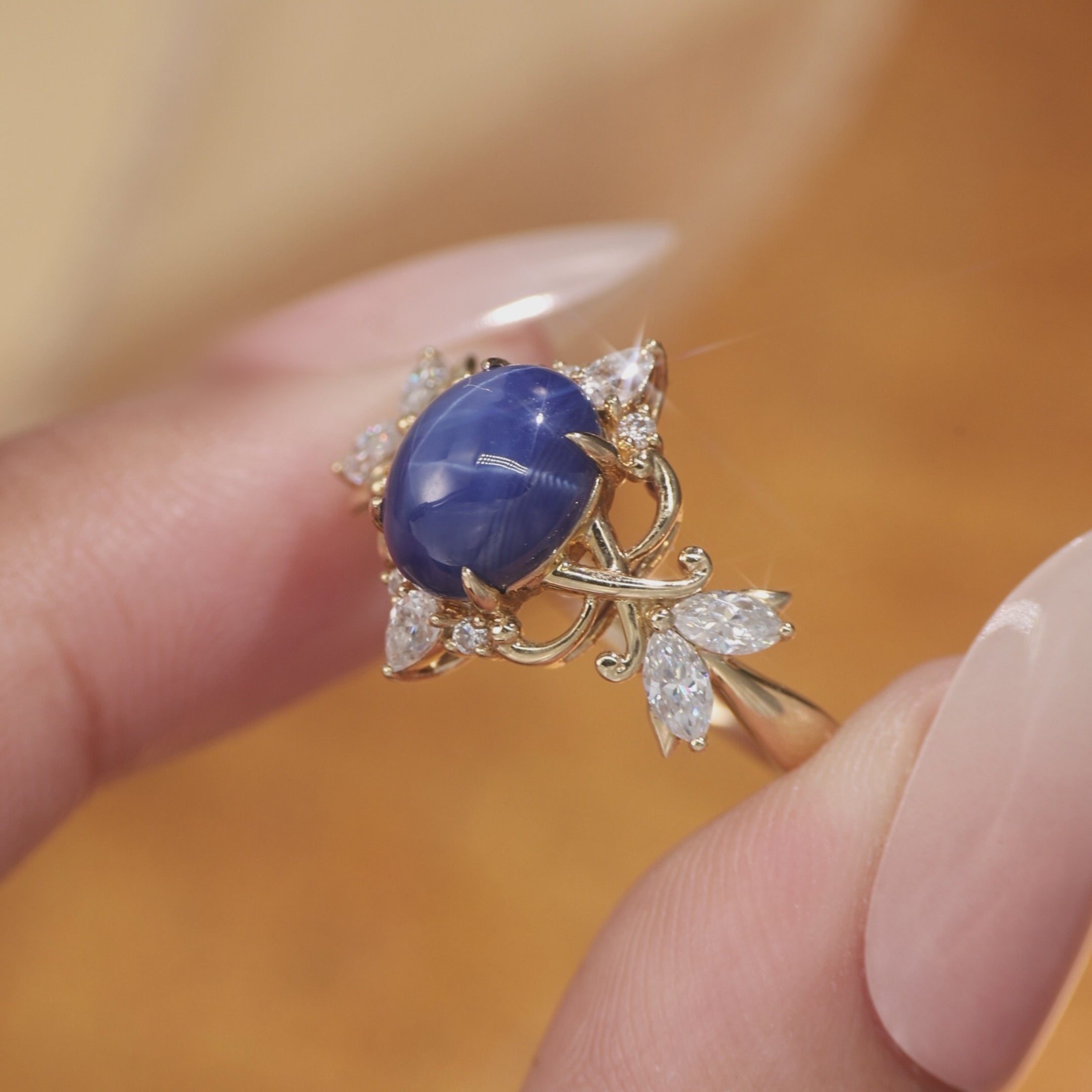 Load video: Oval Cut Star Sapphire Gold Kont &amp; Lotus Inspired Engagement Ring - Neoma